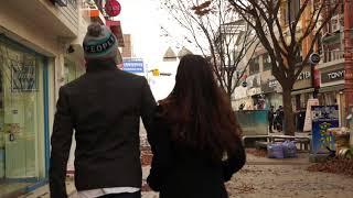 Young Asian Couple Walks Through City (STOCK FOOTAGE)