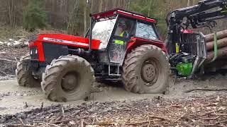 Powerful tractors operate in extreme off road conditions .Tractor drivers are stuck in the mud.