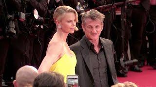 Sean Penn and Charlize Theron shows some PDA at the Mad Max Premiere in Cannes