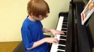 Gavin playing piano, end of year one