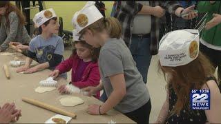 Children learn how to make matzah at Lubavitcher Yeshiva Academy ahead of Passover