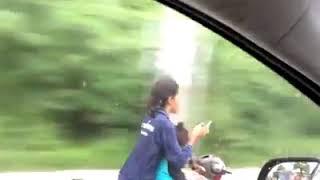 Texting riding motorbike 