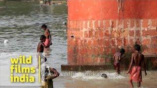 Kids playing in the waters of Hooghly in Kolkata