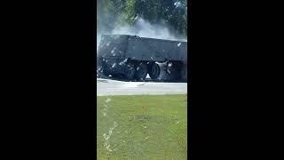 Truck tire catches fire.