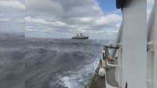 Tugboat crew successfully navigates the SS United States through rough weather