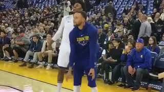 Nick Young goes through his warm-up as Steph Curry mimics his 3 point celebration