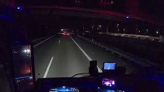 POV Driving Mercedes Actros Gigaspace 1848 in Germany .  Driving at night. Cockpit view 4K