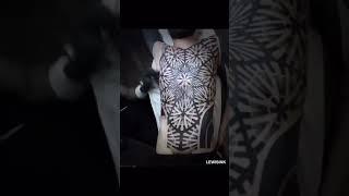Man getting a full-body tattoo.