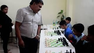 Indian Youth Chess Team Coach, T J Suresh Kumar playing chess simul with Outpace Academy Students.