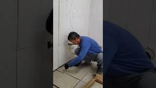 INSTALLING TILES IN OUR LAUNDRY ROOM