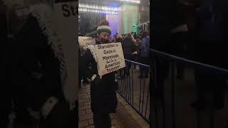 Activists stage protest outside Obama, Merkel event