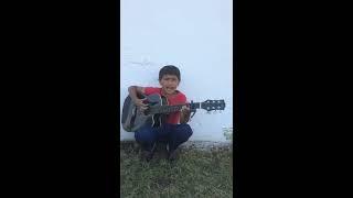 a boy with a guitar TAJIK