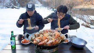 A glass of wine with seafood ramen outdoors with my brother (clams, shrimp, squid, scallops)