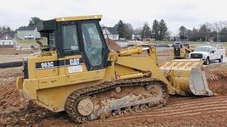 CAT 963C Cleaning Up Around an Excavation