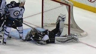 Jonathan Quick lifts his leg for crazy save