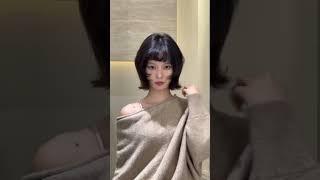 Japanese style short hair with face covering fluffy and slightly curled perm to modify face shape