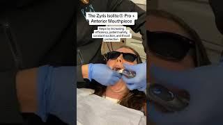 Dentist using a dental isolation system for anteriors