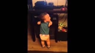 Baby laughing at a cartoon