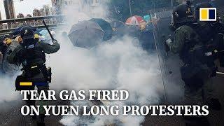 Police fire tear gas at Hong Kong protesters in Yuen Long, as tens of thousands join illegal march