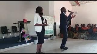 Reagan Mazila live on stage with his wife performing Zion at Muchinga SDA Church.