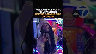 Cop shoots driver through windshield while clinging to hood of car