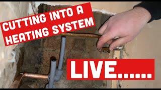 CUTTING INTO LIVE CENTRAL HEATING PIPES to fit RADIATOR without draining the system. Plumbing trick