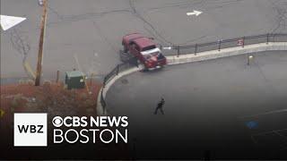 Truck crashes through fence during police chase on North Shore