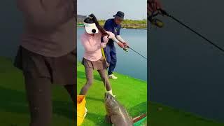 A woman shows how to fish