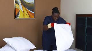Housekeeping - Level 3 - Making the bed and dusting the guest room 1 of 3