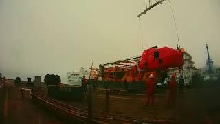 Lifeboat Lowering on Water By Shore Crane