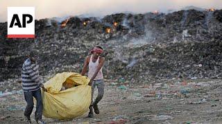 Extreme heat in India makes garbage pickers' miserable and dangerous job worse