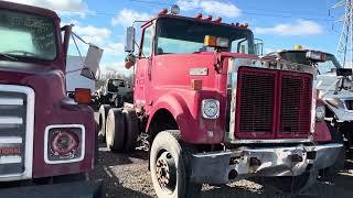 I explore a semi truck salvage yard