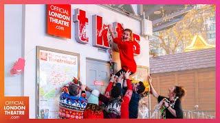 The cast of Elf decorate the iconic TKTS Booth in Leicester Square | Ad