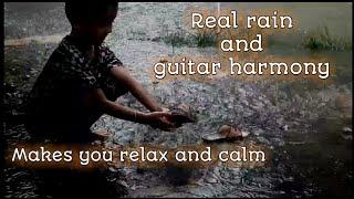 Real rain and guitar harmony