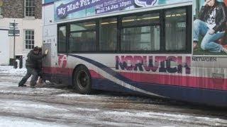 Snowed in! Trapped bus is pushed by passengers in Norwich