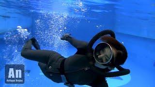 all black diver swimming