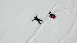 Making Snow Angels on Hyalite Lake Bozeman Montana - Drone Aerial View