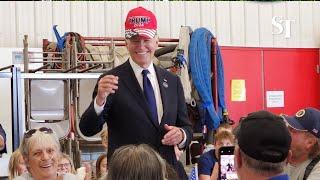 Biden’s Trump hat gesture win cheers from crowd