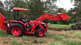 Kubota MX5800 BX92 backhoe vs Stump and pile of logs