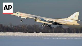 Putin shows muscle with Russia's new military bomber