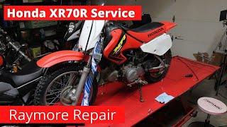 Honda 2002 XR70R Service, Valve adjust cleaning  the oil spinner and steering stem bearings.