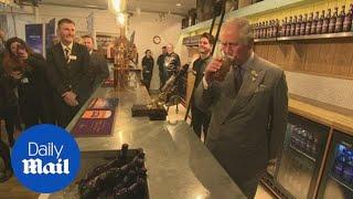 Prince Charles pulls his own pint at St Austell brewery in Cornwell