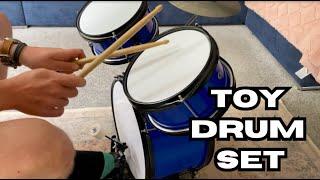 I bought my kids a toy drum set and tried it out first!