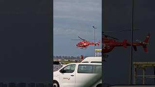 Emergency 112 helicopter takeoff with water bucket attached