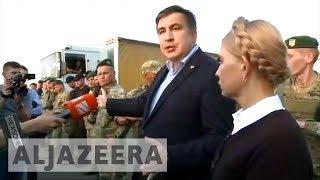 Ex-Georgian leader Mikhail Saakashvili forces his way into Ukraine