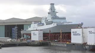 HMS Glasgow moving from the quay side at BAE systems Govan to a barge as first step of the launch