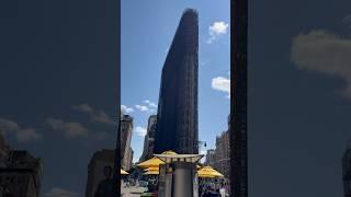 View of the iconic Flatiron Building with scaffolding for restoration in Manhattan, New York City!