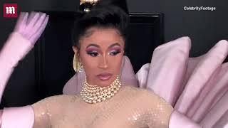 Cardi B and Offset touch tongues at the 2019 Grammy Awards