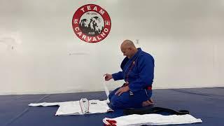 Sensei Edson Carvalho demonstrates how to fold a gi into a carry bag