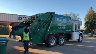 Waste Pro Leach 2RIII Rear Loader Garbage Truck In A Small Town